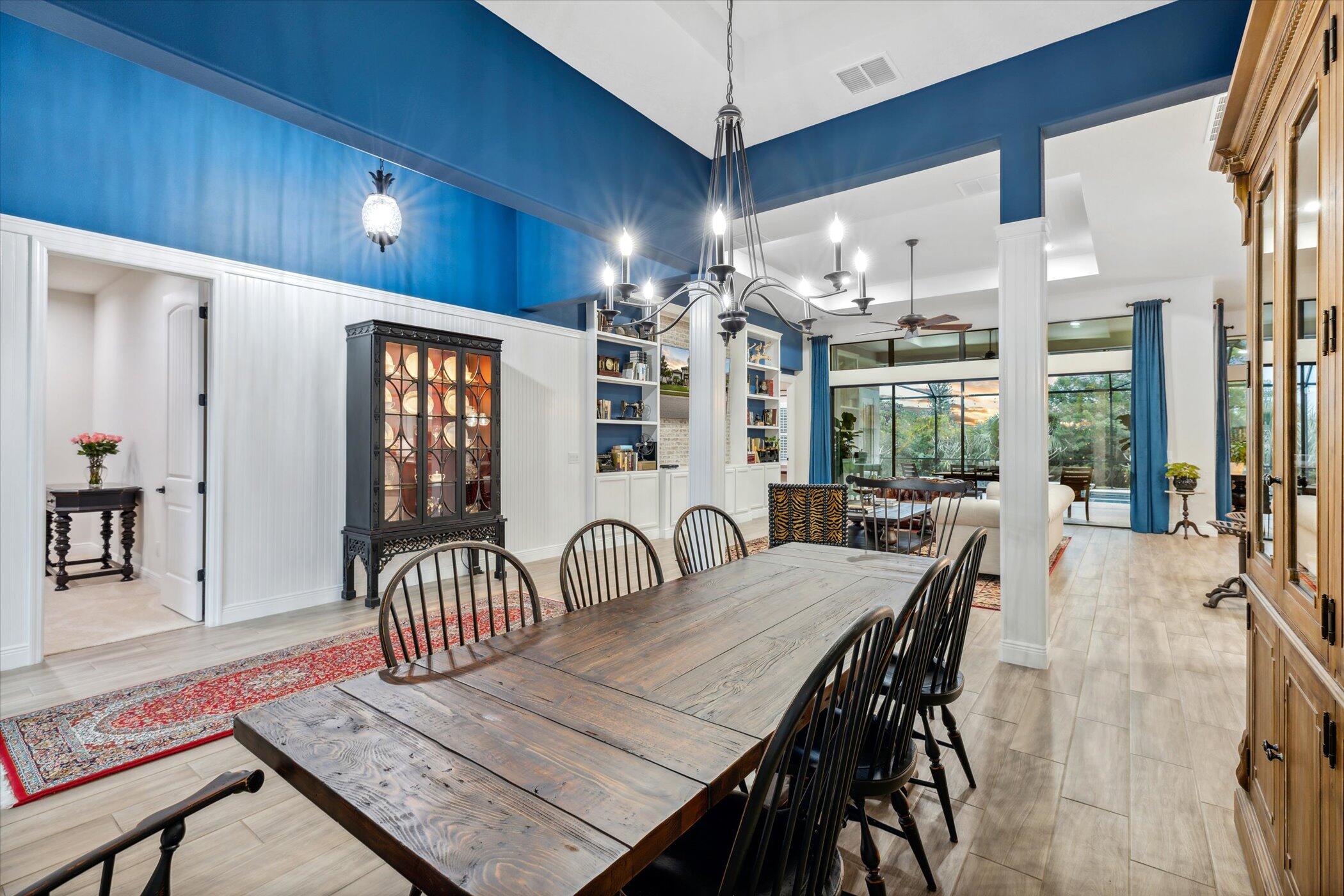 5420 Calder Drive Melbourne, FL 32940 - Photo 12 of 73 a view of a dining room with furniture and chandelier
