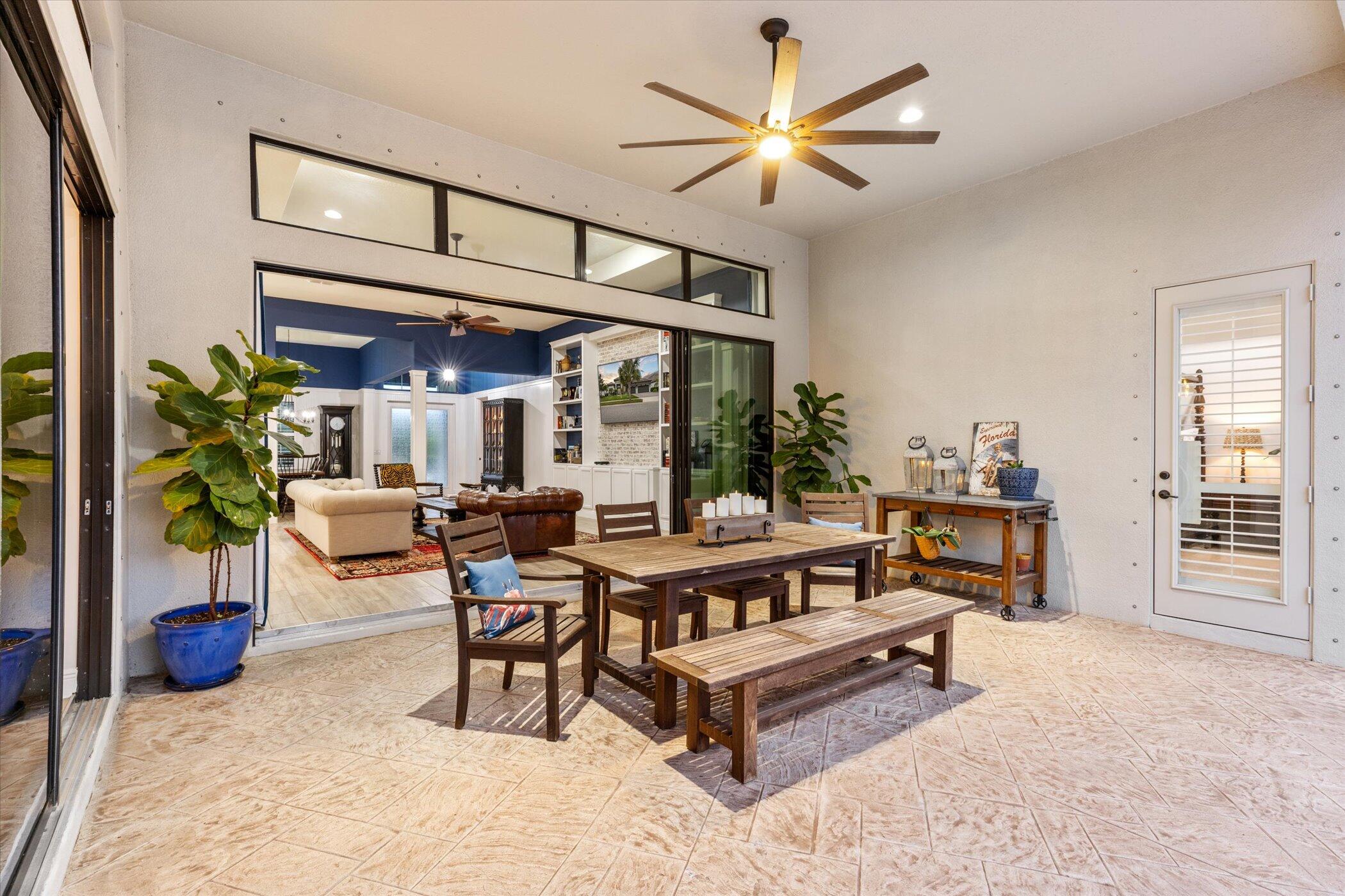 5420 Calder Drive Melbourne, FL 32940 - Photo 15 of 73 a living room with furniture a dining table and a large window