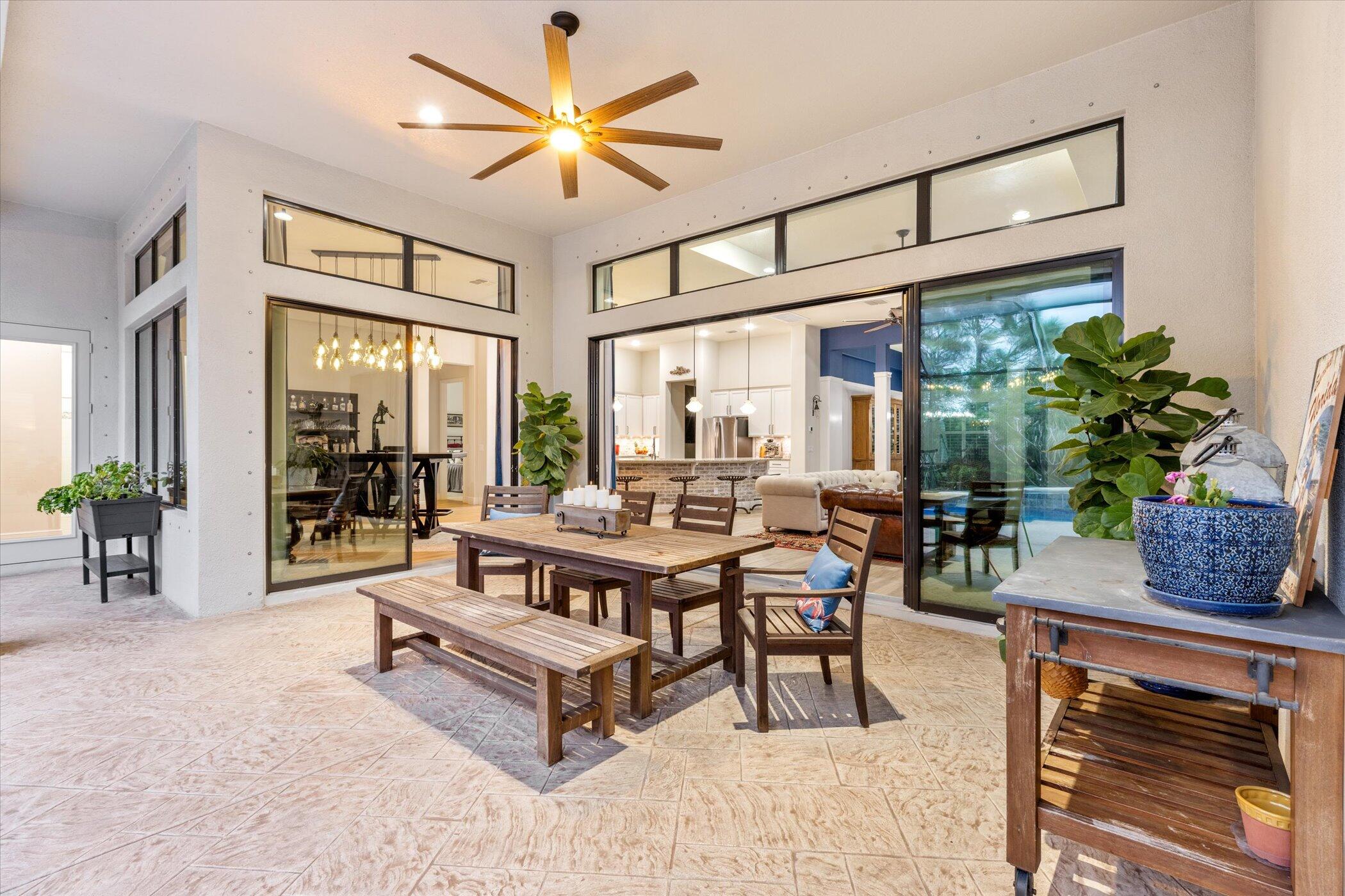 5420 Calder Drive Melbourne, FL 32940 - Photo 17 of 73 a living room with furniture a chandelier and a table