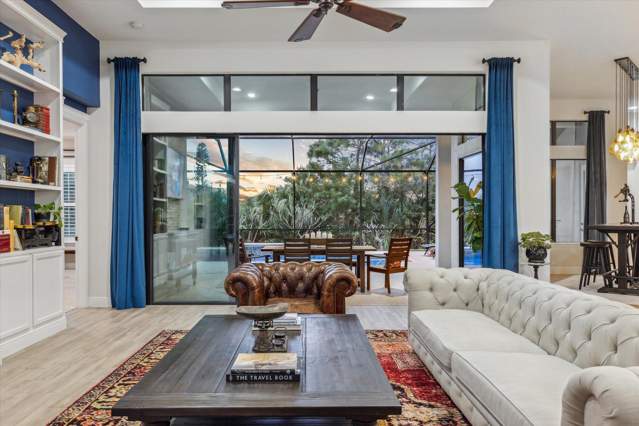 5420 Calder Drive Melbourne, FL 32940 - Photo 19 of 73 a living room with furniture a rug and a large window
