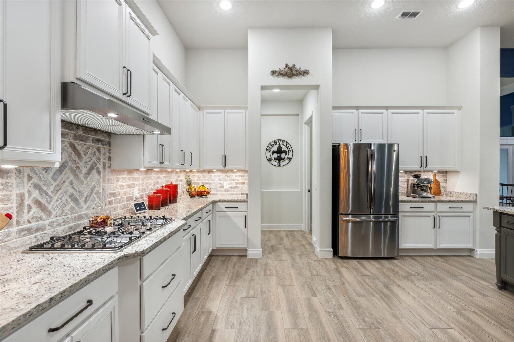 5420 Calder Drive Melbourne, FL 32940 - Photo 27 of 73 a kitchen with refrigerator and cabinets