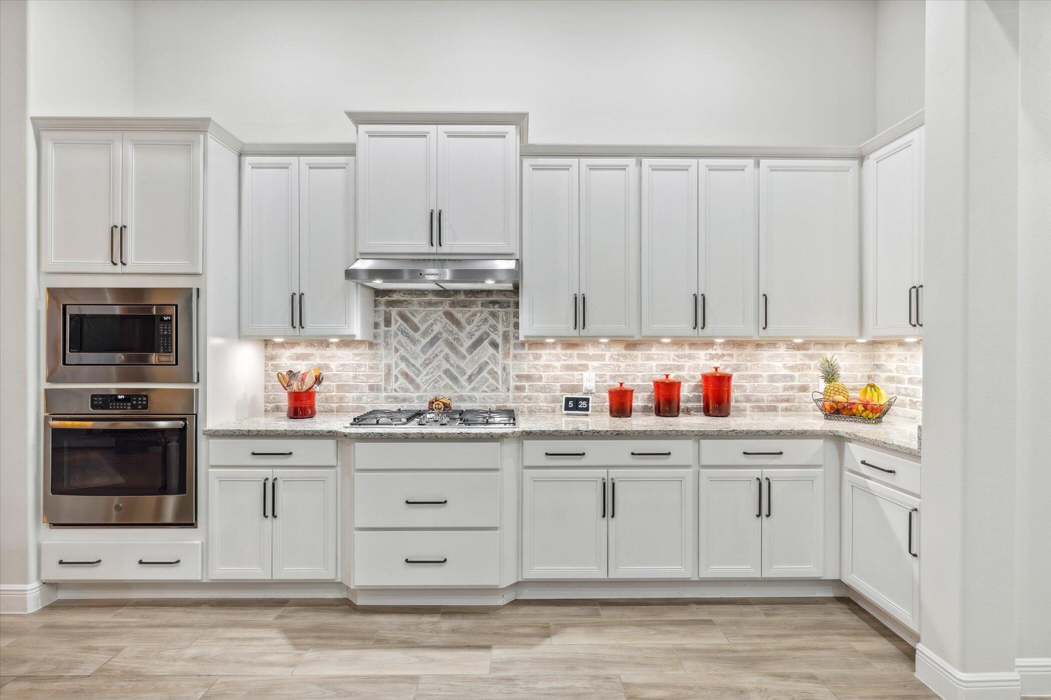 5420 Calder Drive Melbourne, FL 32940 - Photo 28 of 73 a kitchen with white cabinets and sink