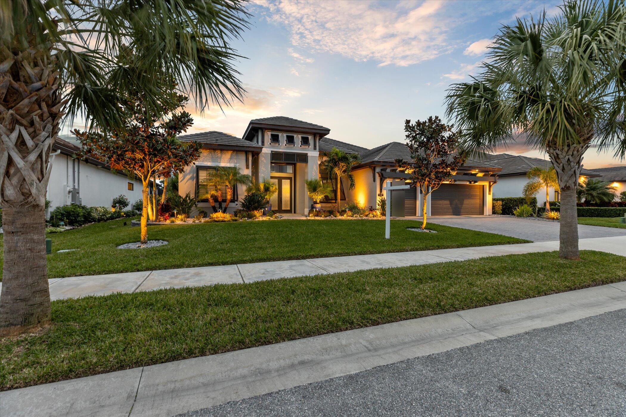 5420 Calder Drive Melbourne, FL 32940 - Photo 3 of 73 a view of a white house with a big yard and palm trees