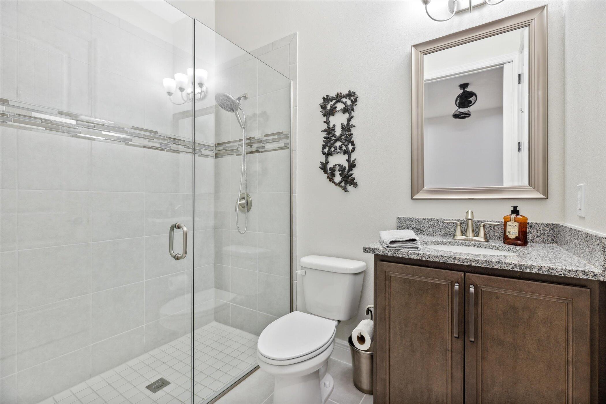 5420 Calder Drive Melbourne, FL 32940 - Photo 36 of 73 a bathroom with a granite countertop sink toilet and shower