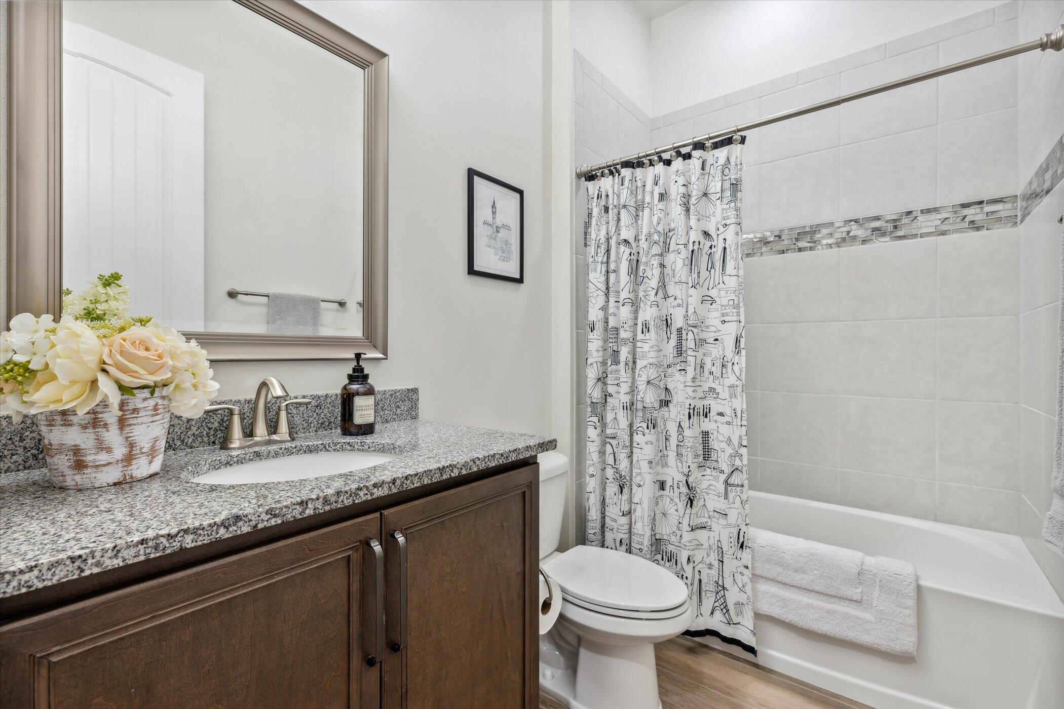 5420 Calder Drive Melbourne, FL 32940 - Photo 39 of 73 a bathroom with a granite countertop sink and a mirror
