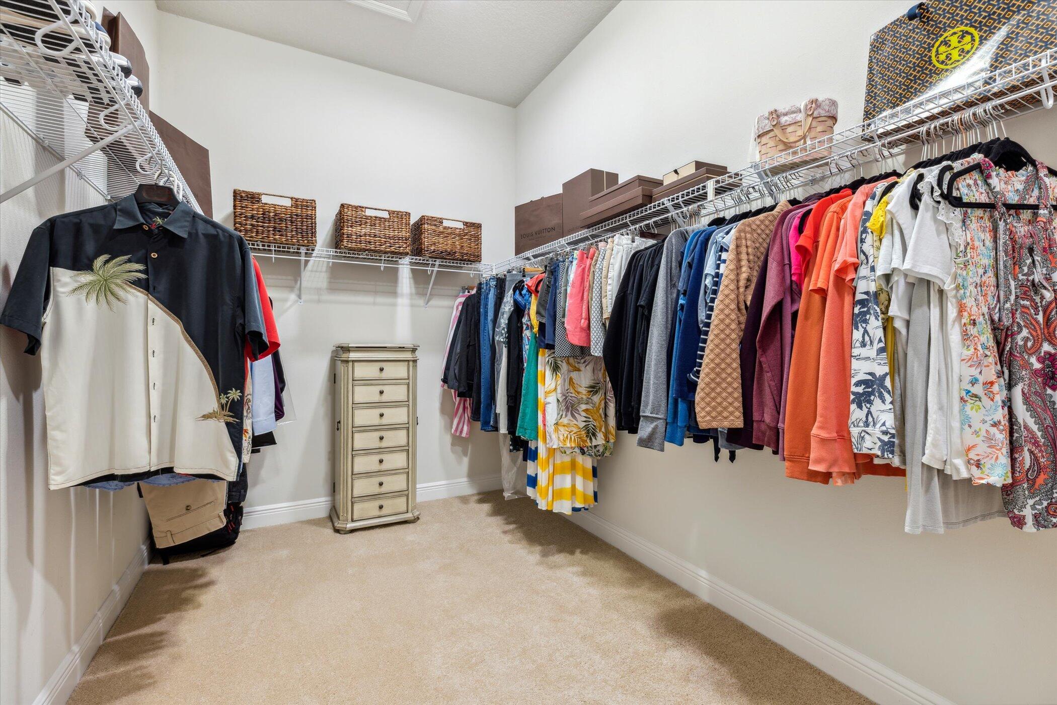 5420 Calder Drive Melbourne, FL 32940 - Photo 42 of 73 a view of walk in closet with clothes and shoes