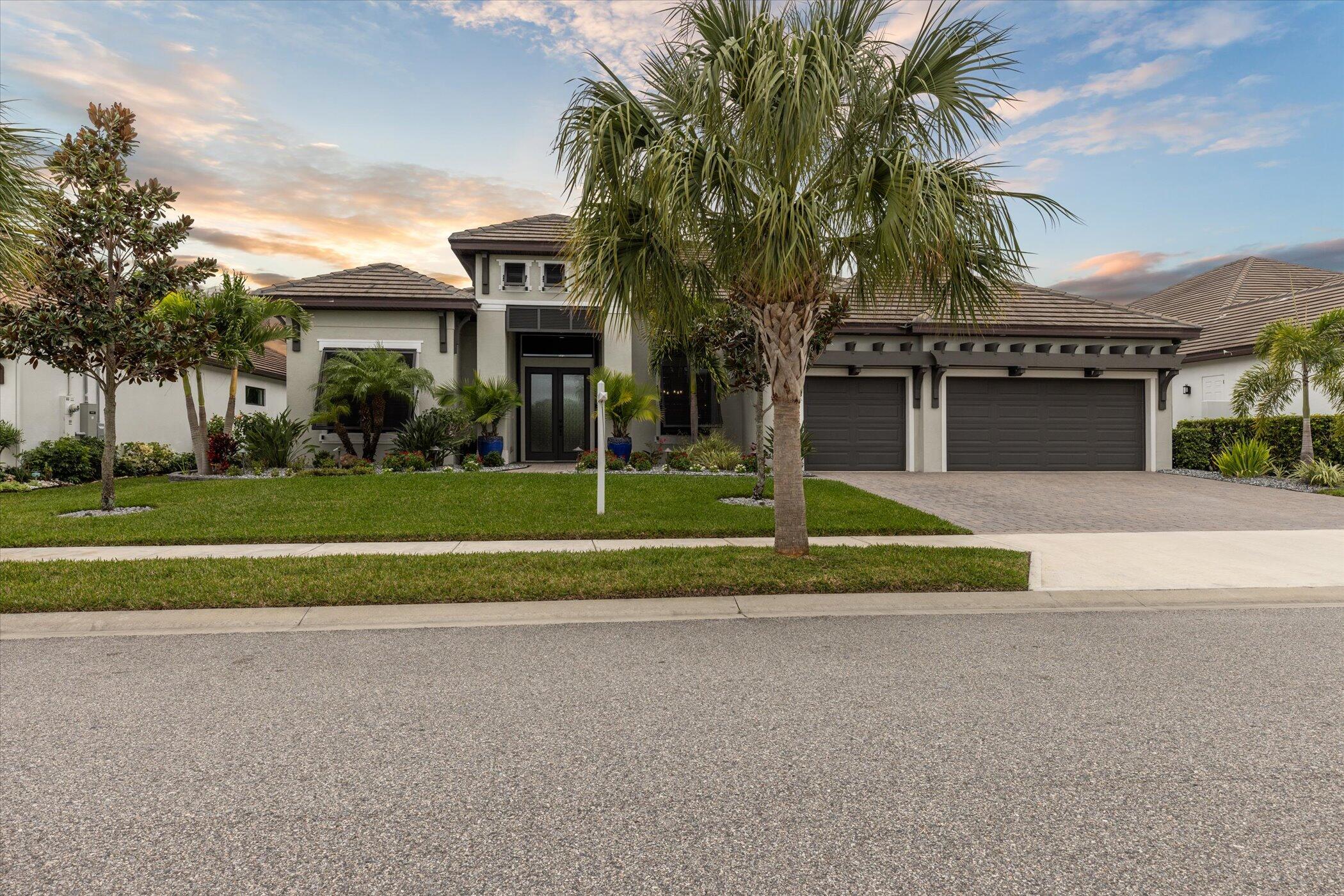 5420 Calder Drive Melbourne, FL 32940 - Photo 67 of 73 a view of a house with a yard and palm trees