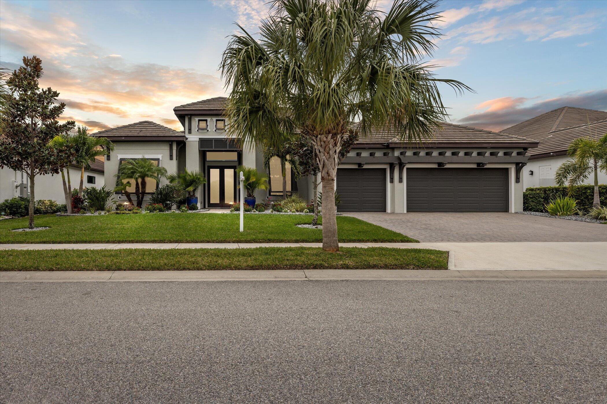 5420 Calder Drive Melbourne, FL 32940 - Photo 71 of 73 a front view of a building with a garden and trees