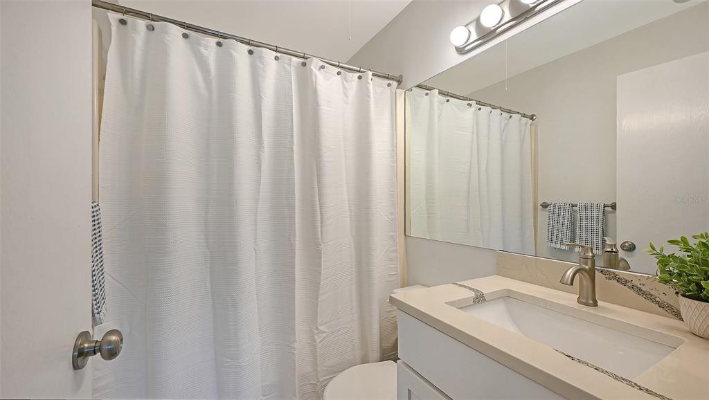 3201 South Beneva Road, Unit 204 Sarasota, FL 34232 - Photo 17 of 34 a bathroom with a sink and a mirror