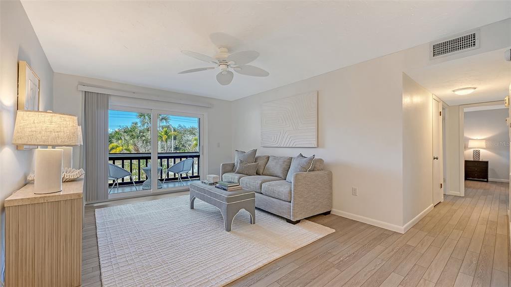 3201 South Beneva Road, Unit 204 Sarasota, FL 34232 - Photo 2 of 34 a living room with furniture and a large window