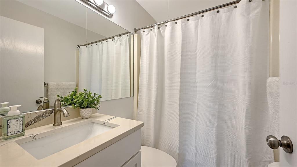 3201 South Beneva Road, Unit 204 Sarasota, FL 34232 - Photo 21 of 34 a bathroom with a sink and a mirror