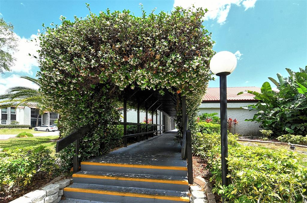 3201 South Beneva Road, Unit 204 Sarasota, FL 34232 - Photo 25 of 34 a front view of a house with a yard