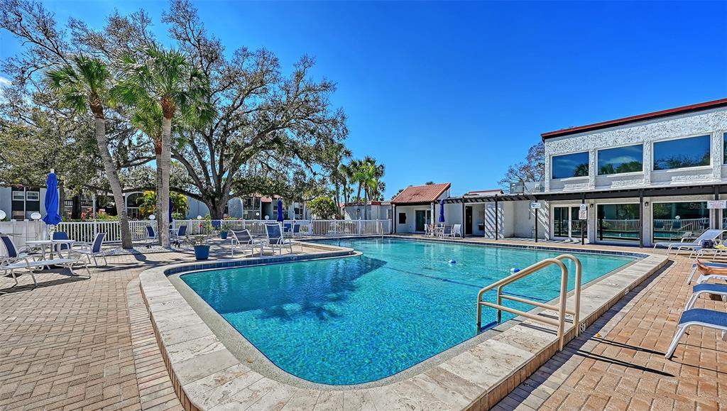 3201 South Beneva Road, Unit 204 Sarasota, FL 34232 - Photo 27 of 34 a view of a swimming pool with lounge chair
