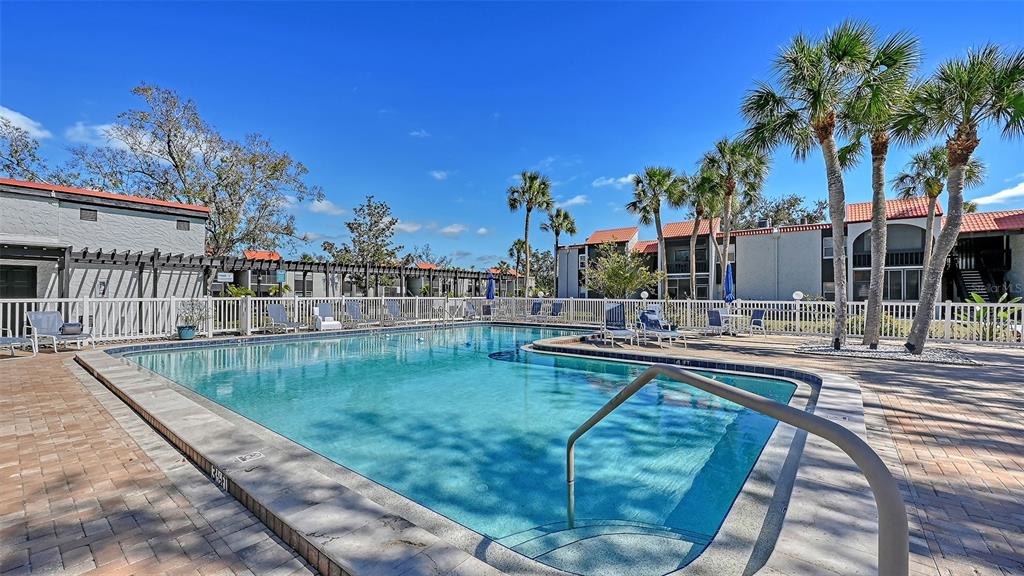3201 South Beneva Road, Unit 204 Sarasota, FL 34232 - Photo 28 of 34 a view of backyard with swimming pool and outdoor seating