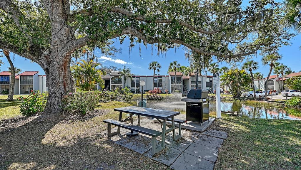 3201 South Beneva Road, Unit 204 Sarasota, FL 34232 - Photo 30 of 34 a view of a house with backyard and sitting area