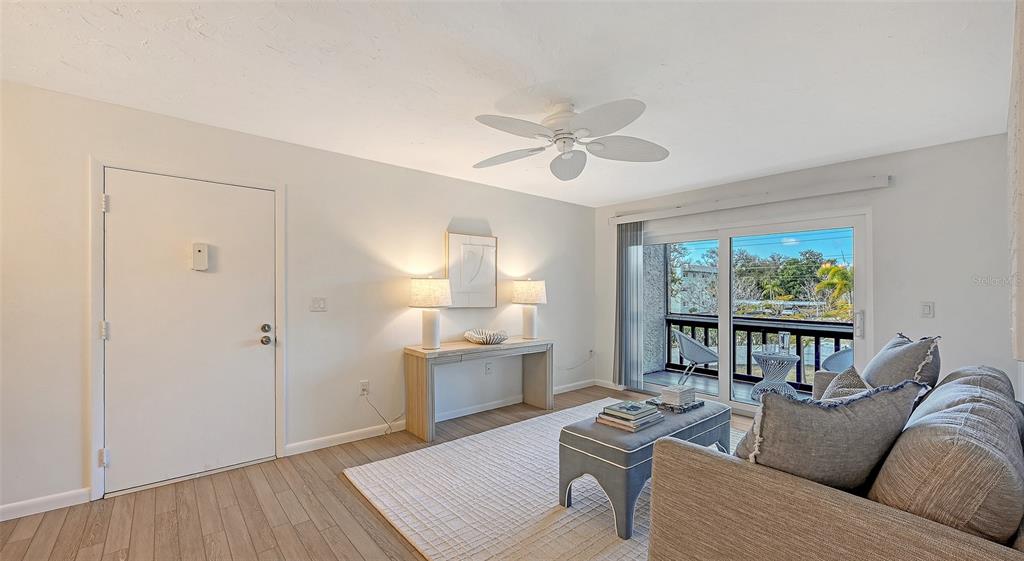 3201 South Beneva Road, Unit 204 Sarasota, FL 34232 - Photo 3 of 34 a living room with furniture and a large window