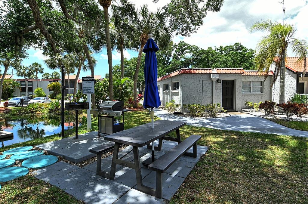 3201 South Beneva Road, Unit 204 Sarasota, FL 34232 - Photo 31 of 34 a view of a backyard with sitting area and furniture
