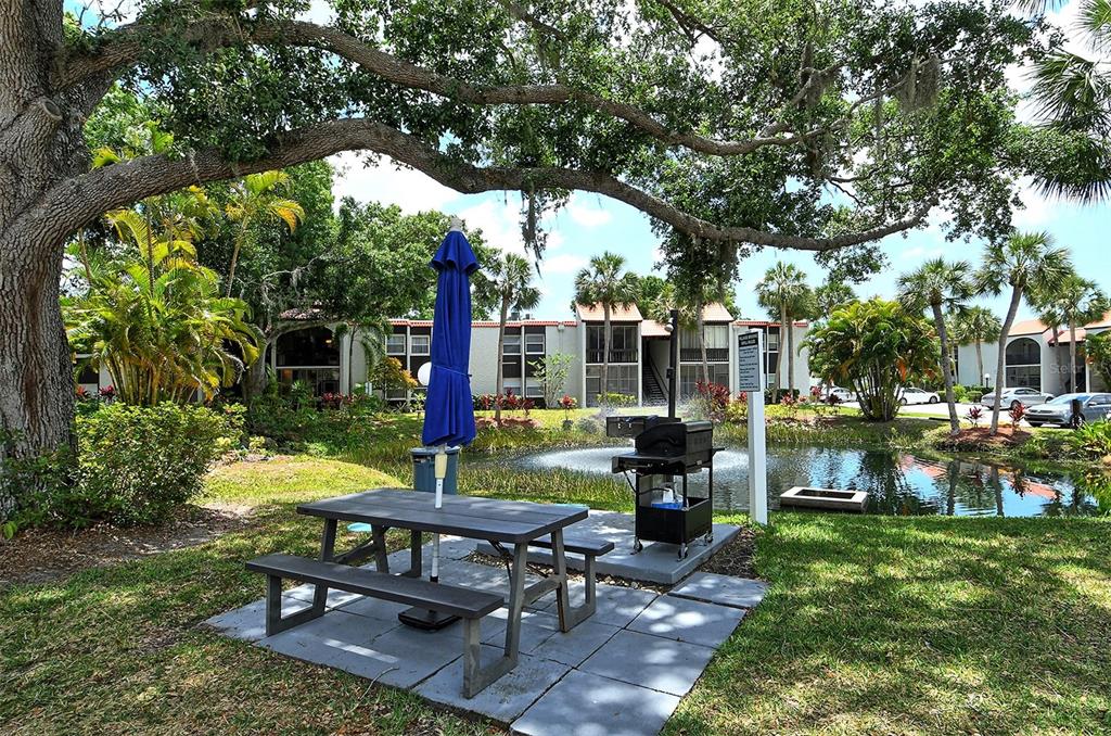 3201 South Beneva Road, Unit 204 Sarasota, FL 34232 - Photo 32 of 34 a view of a yard with furniture and a garden