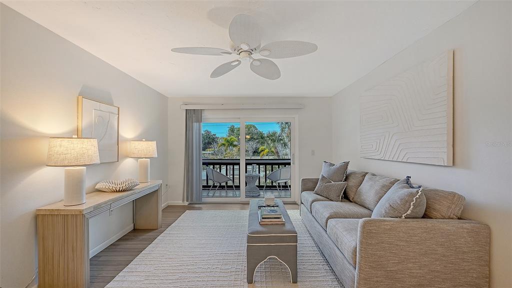 3201 South Beneva Road, Unit 204 Sarasota, FL 34232 - Photo 4 of 34 a living room with furniture and a large window