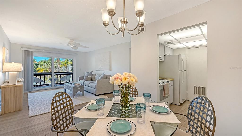 3201 South Beneva Road, Unit 204 Sarasota, FL 34232 - Photo 10 of 34 a living room with furniture and wooden floor