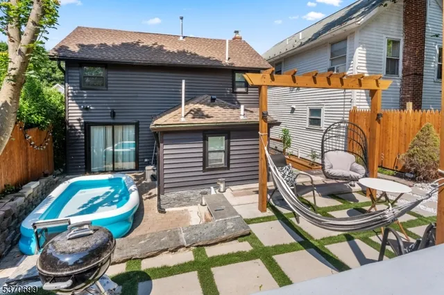 a backyard of a house with seating space