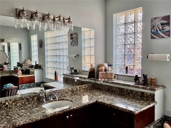 a kitchen with granite countertop a sink and a granite counter tops