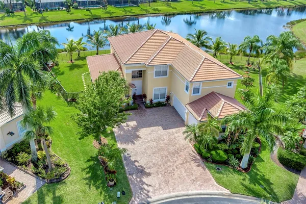 an aerial view of a house with a yard and a garden