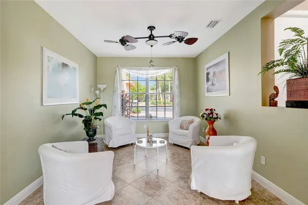 a living room with furniture and windows