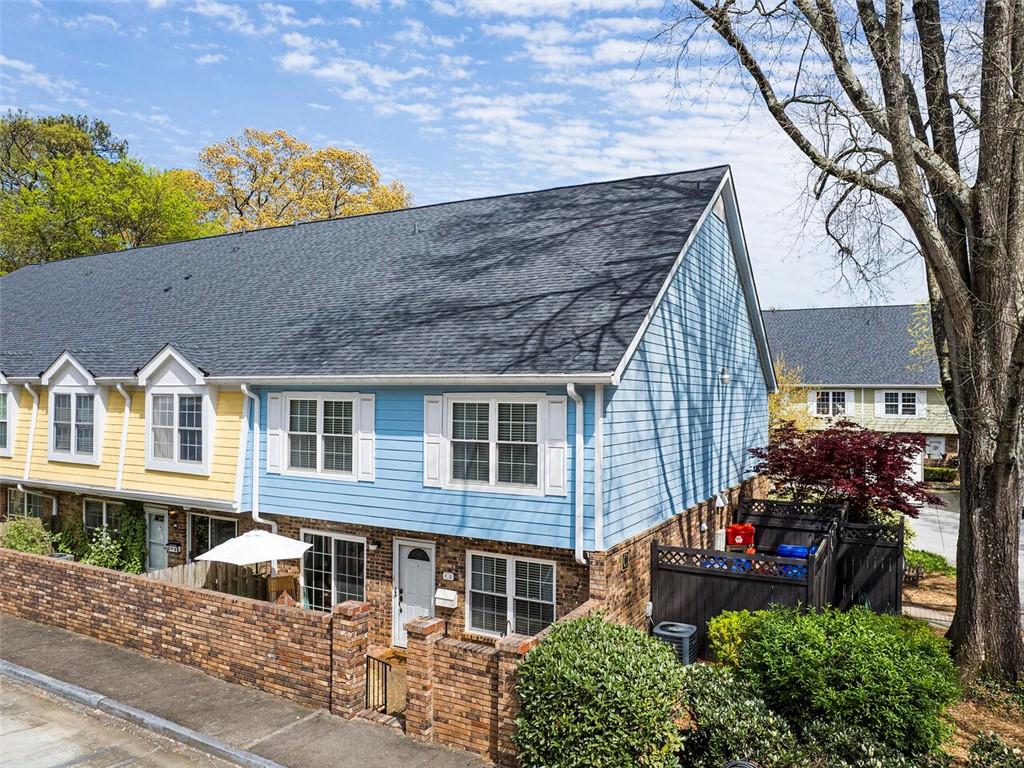 307 Adair Street, Unit C4 Decatur, GA 30030 - Photo 1 of 1 front view of a house with a small yard