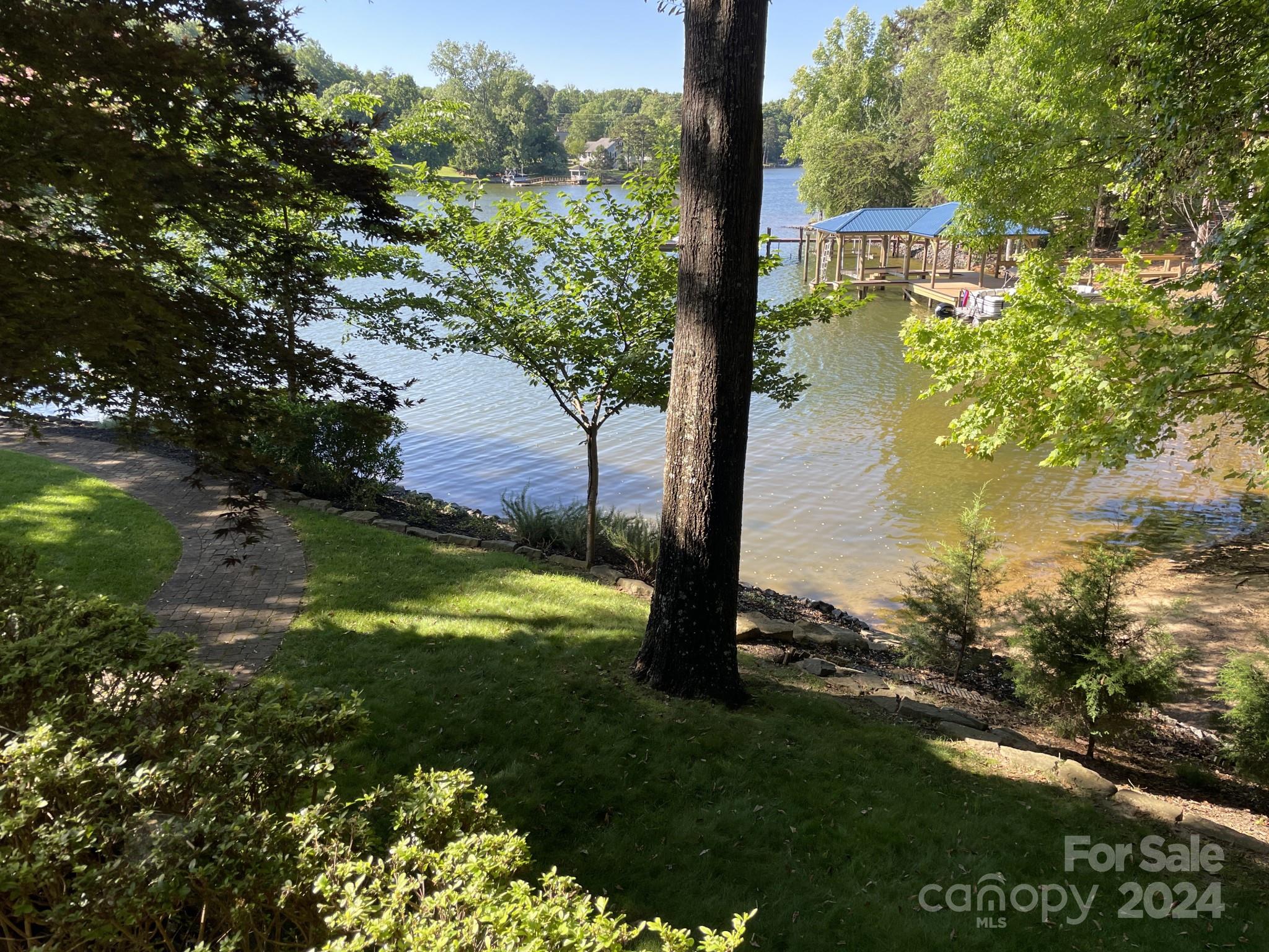 936 Rocky Point Lane Tega Cay, SC 29708 - Photo 15 of 48 a view of a lake from a yard