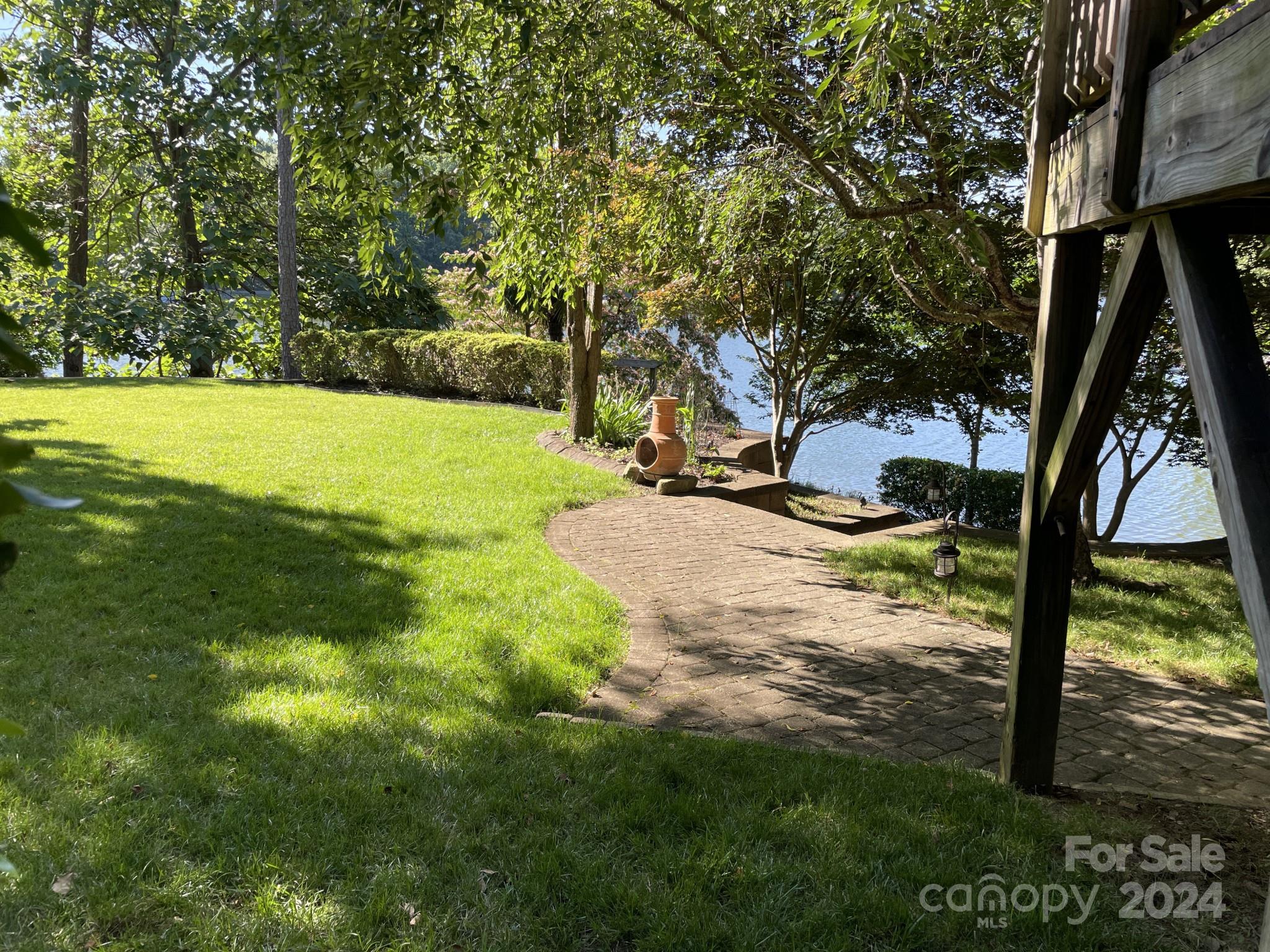 936 Rocky Point Lane Tega Cay, SC 29708 - Photo 16 of 48 a view of backyard with tree