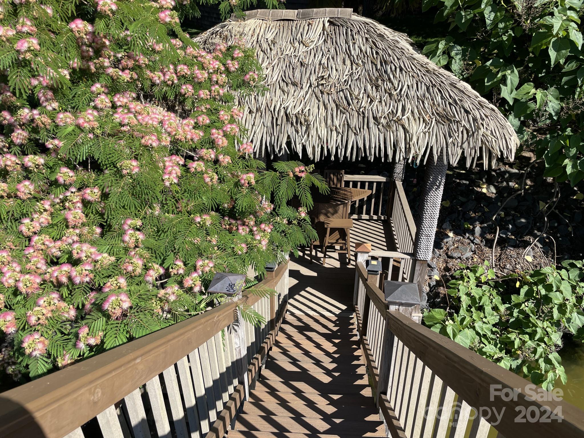 936 Rocky Point Lane Tega Cay, SC 29708 - Photo 26 of 48 a view of a garden from a balcony