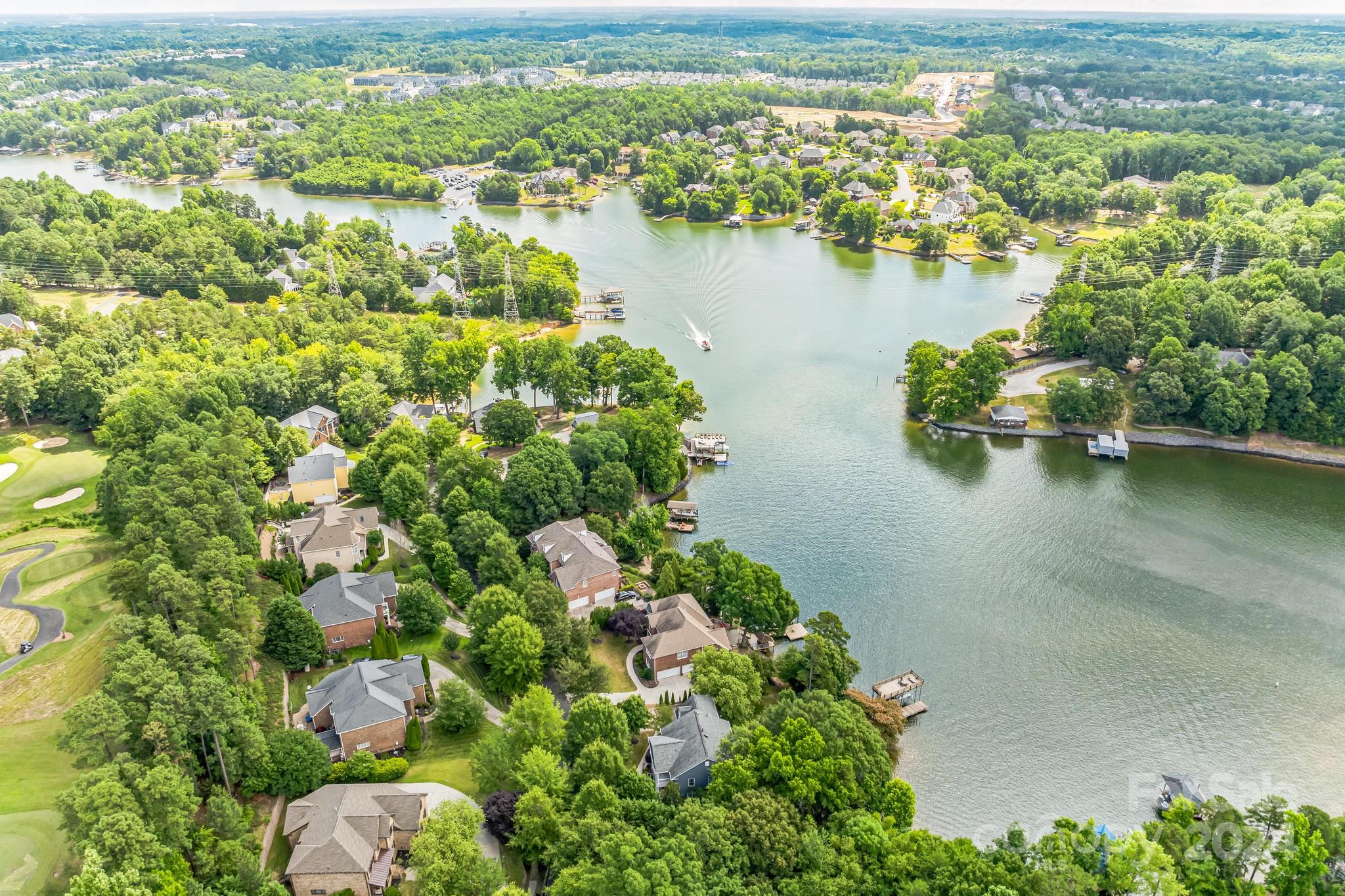 936 Rocky Point Lane Tega Cay, SC 29708 - Photo 3 of 48 an aerial view of residential houses with outdoor space and lake view