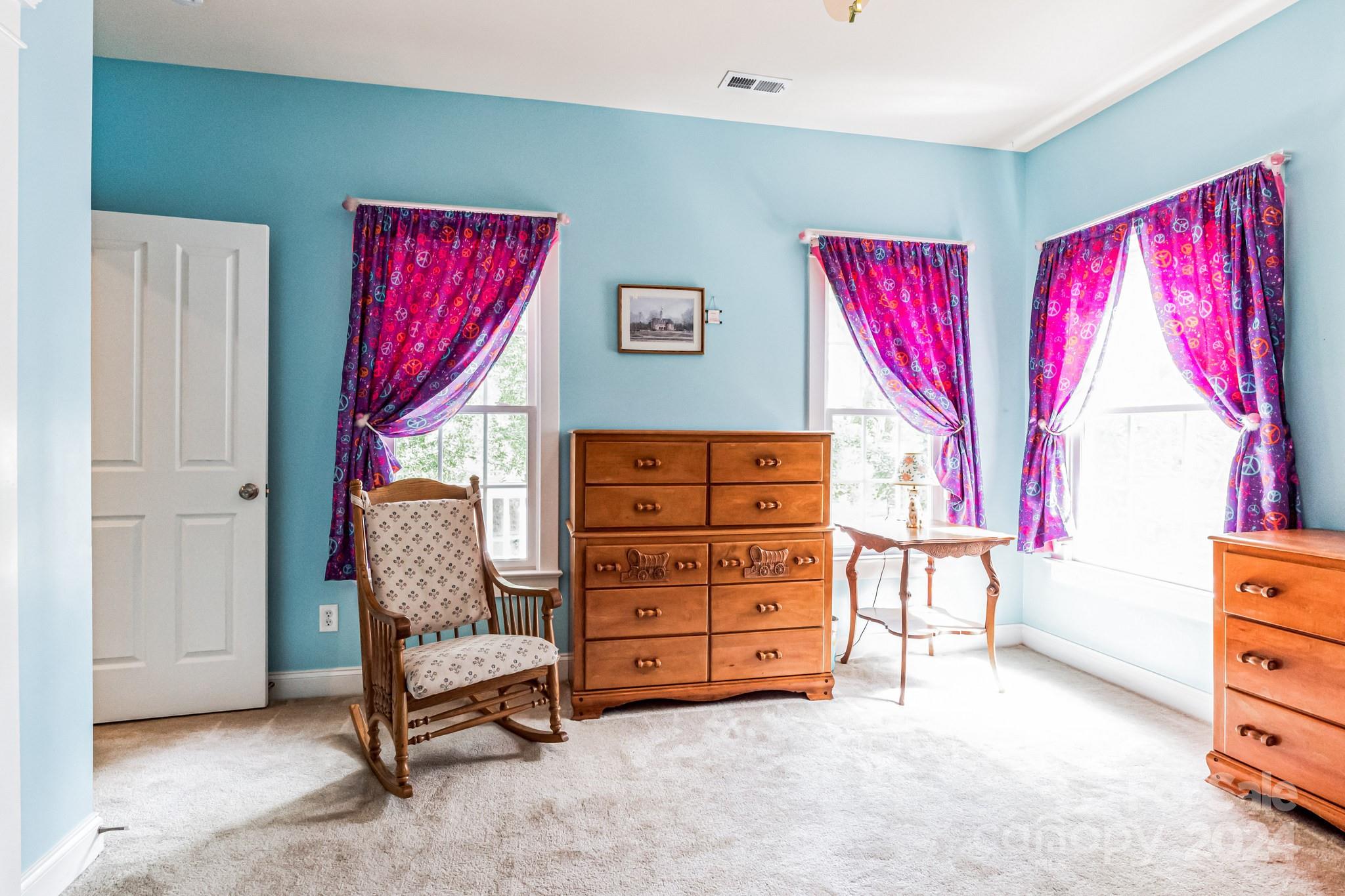 936 Rocky Point Lane Tega Cay, SC 29708 - Photo 34 of 48 a view of a bedroom with furniture and window