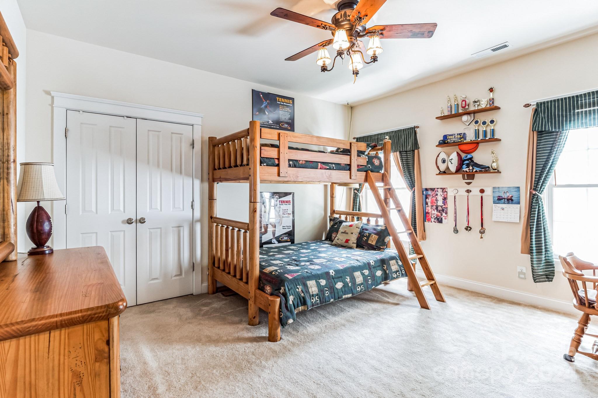 936 Rocky Point Lane Tega Cay, SC 29708 - Photo 35 of 48 a bedroom with furniture and a window