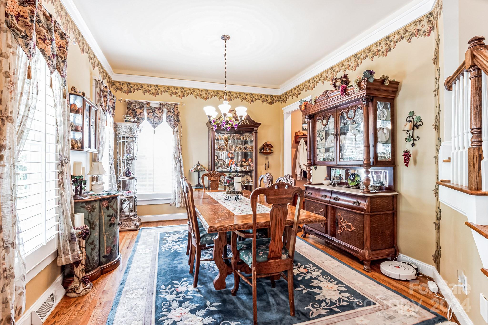 936 Rocky Point Lane Tega Cay, SC 29708 - Photo 39 of 48 a view of a dining room with furniture window and wooden floor