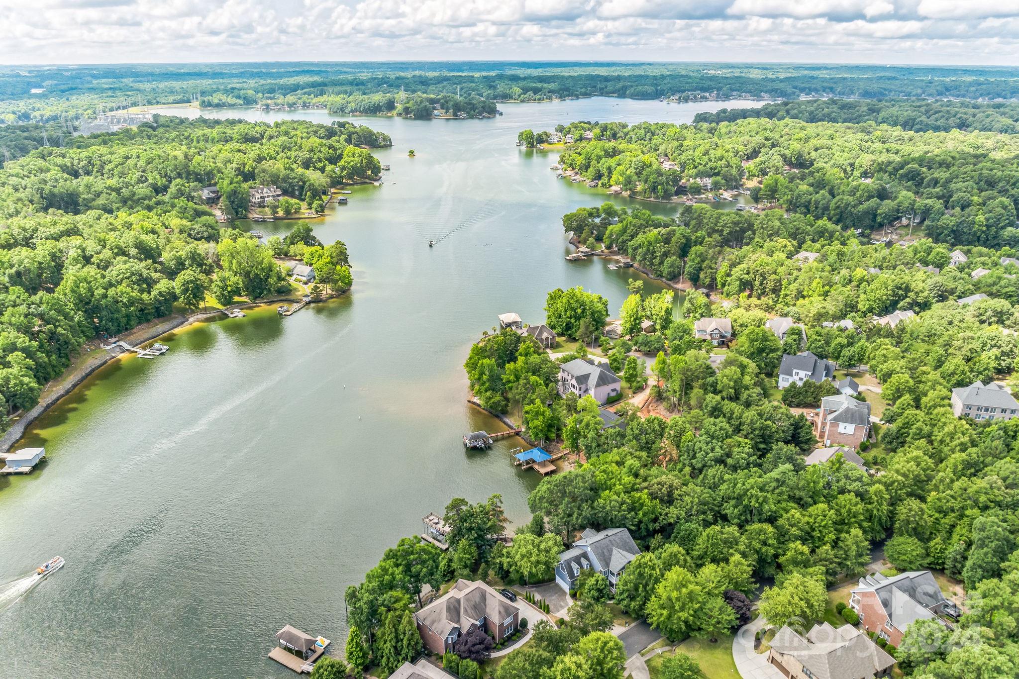 936 Rocky Point Lane Tega Cay, SC 29708 - Photo 4 of 48 a view of a lake with a yard