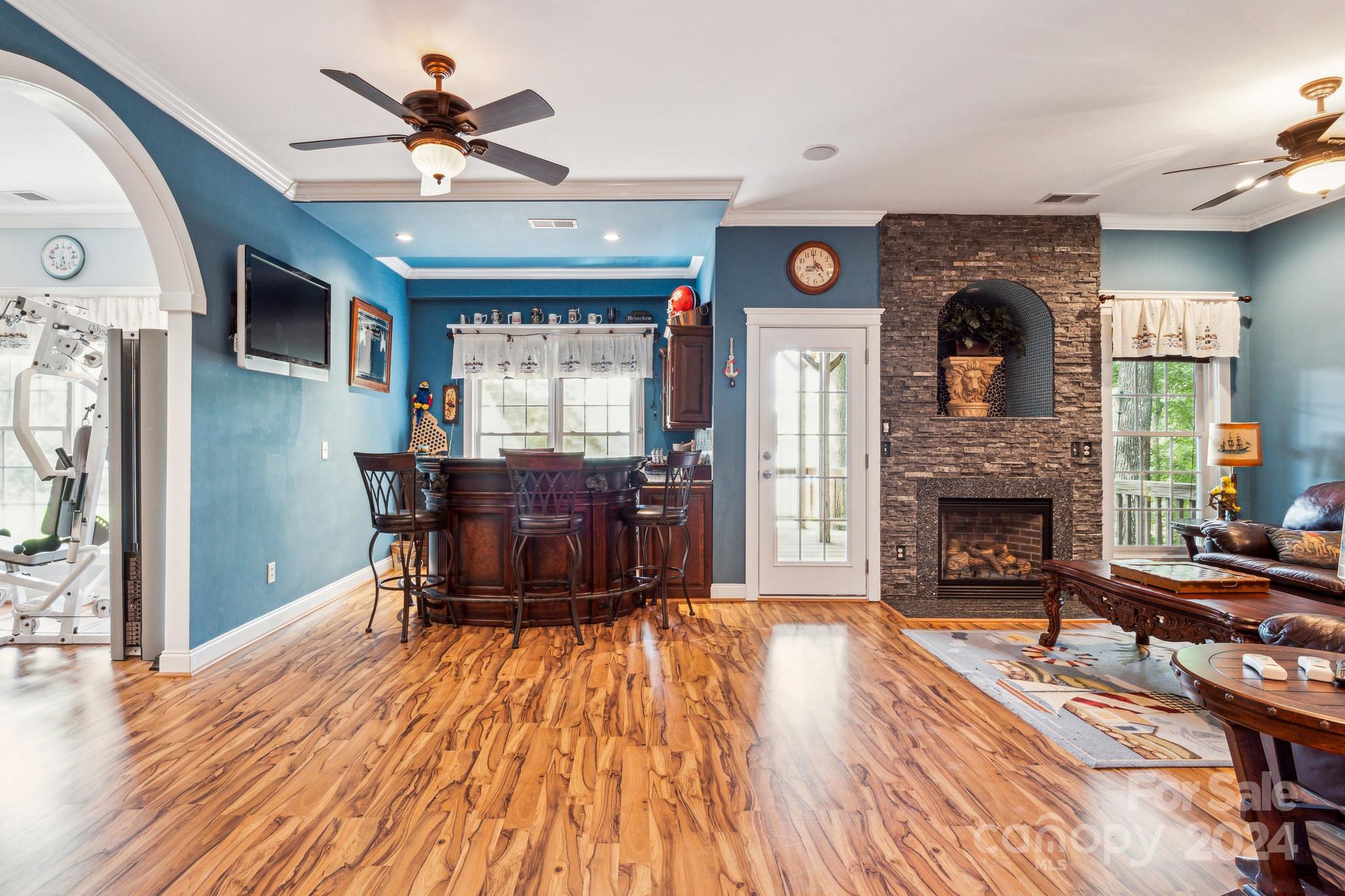 936 Rocky Point Lane Tega Cay, SC 29708 - Photo 46 of 48 a living room with furniture and a fireplace