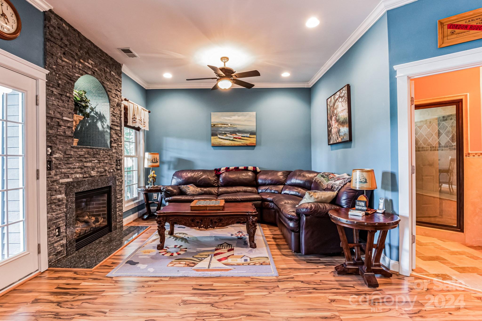 936 Rocky Point Lane Tega Cay, SC 29708 - Photo 47 of 48 a living room with fireplace furniture and a fireplace