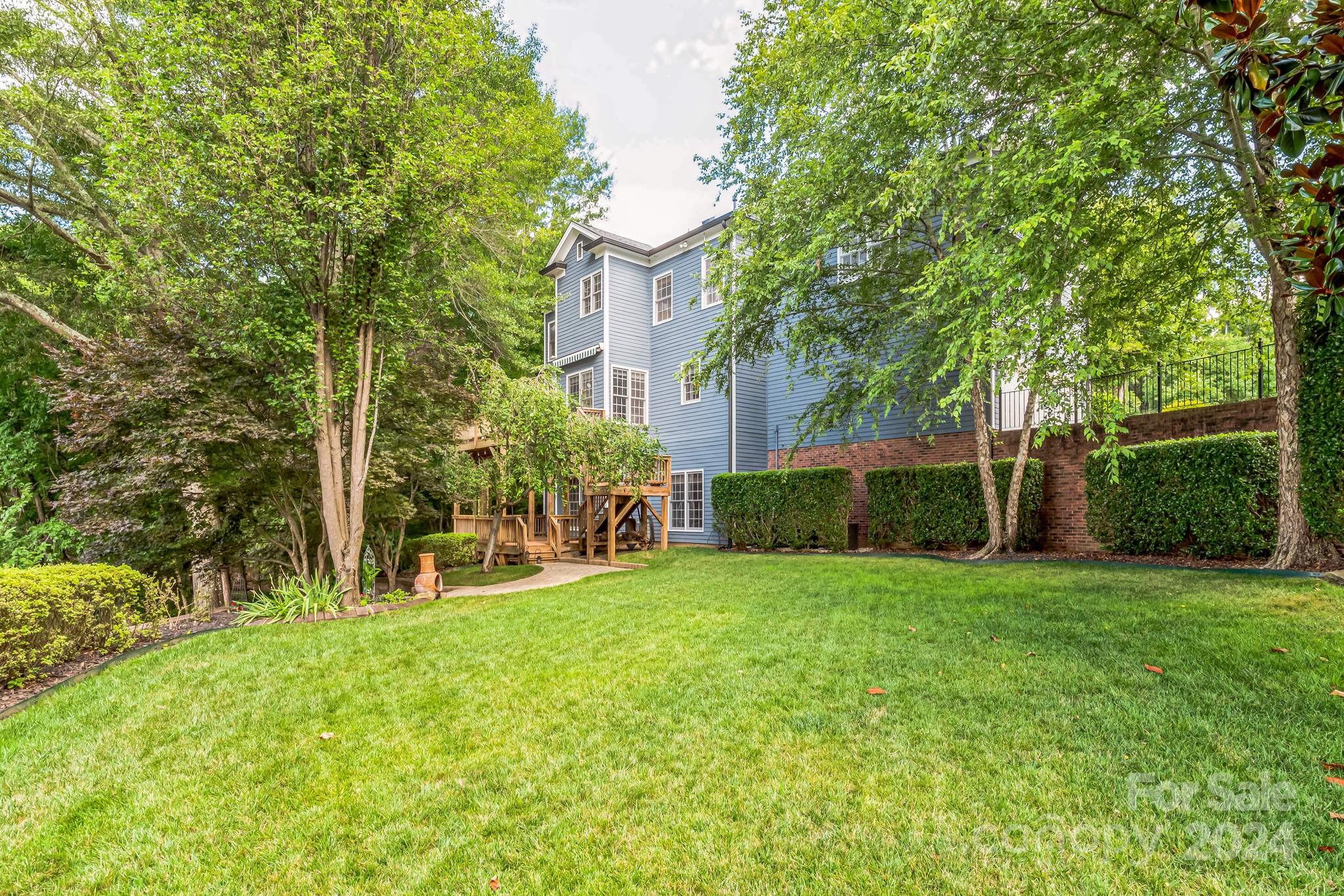 936 Rocky Point Lane Tega Cay, SC 29708 - Photo 9 of 48 a view of a house with a yard and sitting area