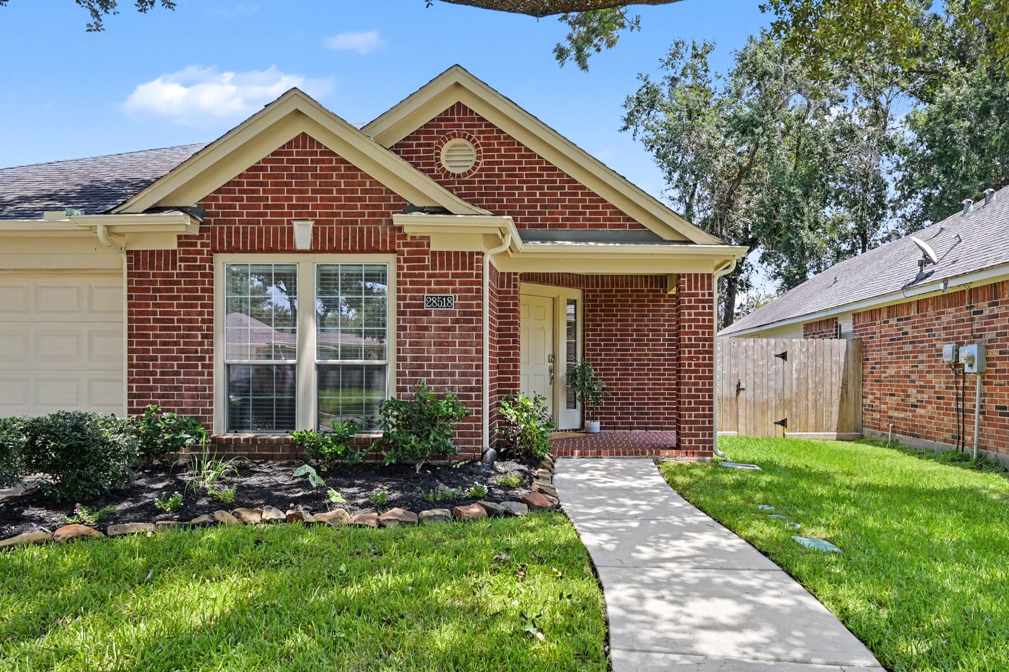 28518 Ashlyn Ridge Lane Spring, TX 77386 - Photo 4 of 50 Now let's venture up your sidewalk for a closer look at that spacious front porch.