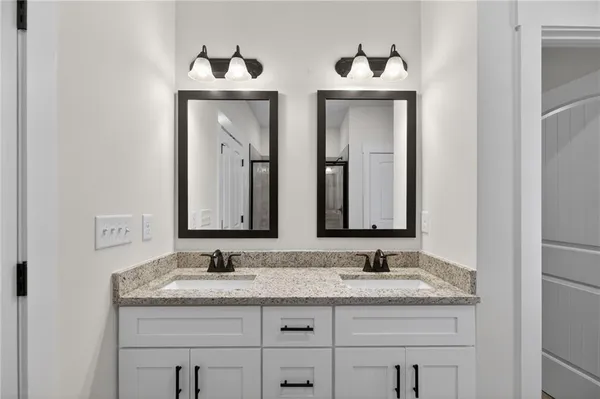 a bathroom with a glass shower door
