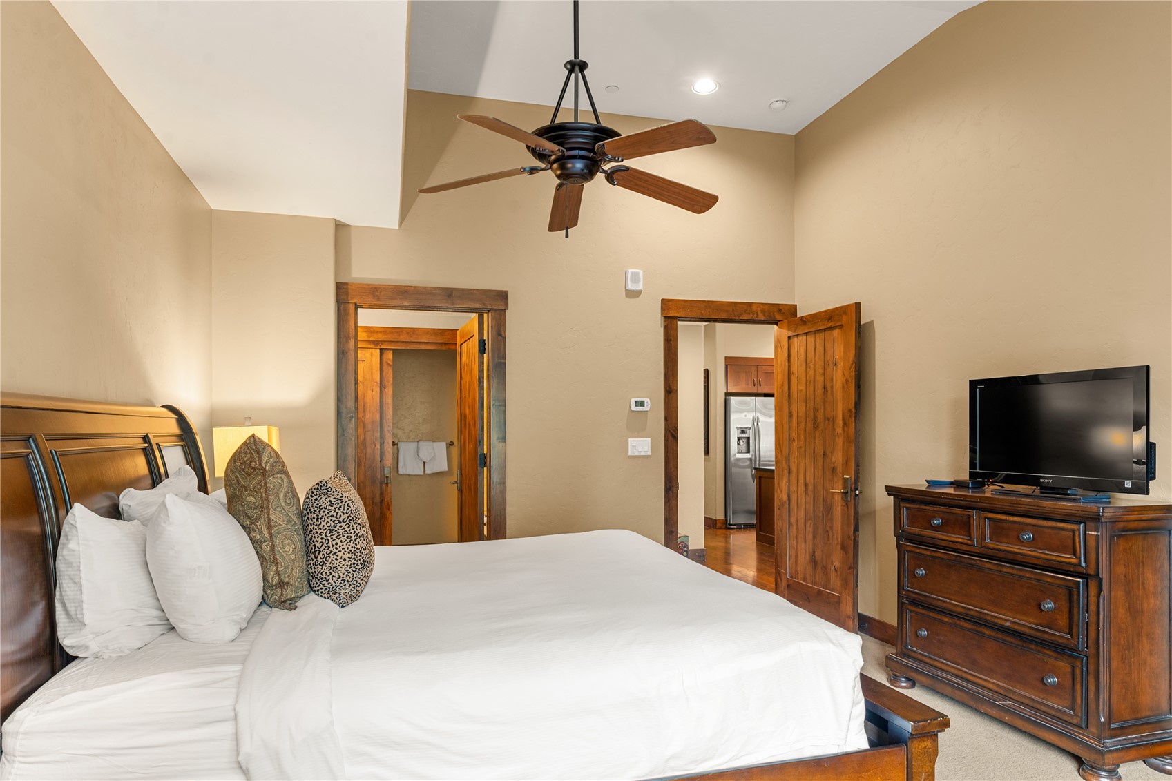 600 Columbine Road, Unit 5310 Breckenridge, CO 80424 - Photo 13 of 38 a bedroom with a bed and a flat screen tv