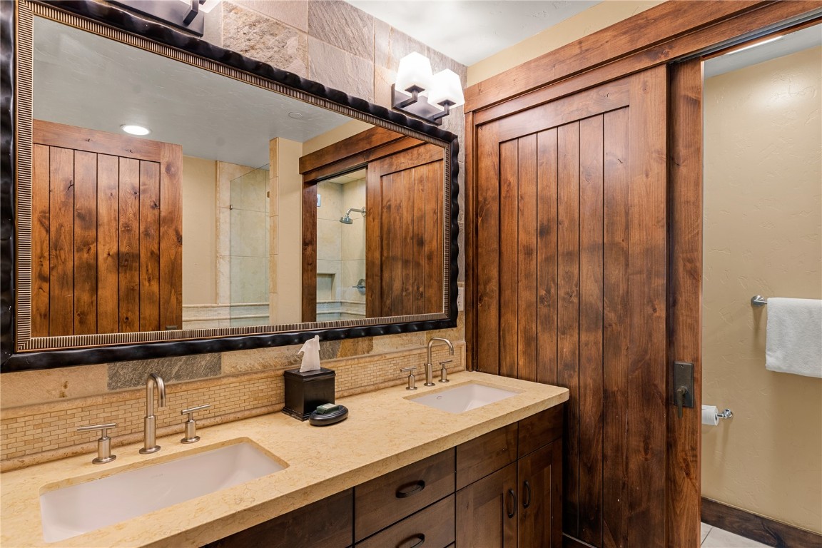 600 Columbine Road, Unit 5310 Breckenridge, CO 80424 - Photo 15 of 38 a bathroom with a sink and a mirror