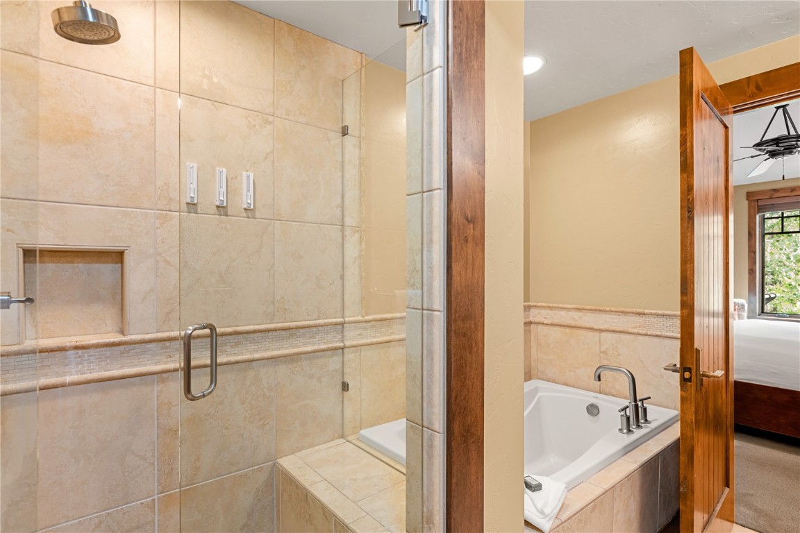 600 Columbine Road, Unit 5310 Breckenridge, CO 80424 - Photo 16 of 38 a bathroom with a tub and a shower