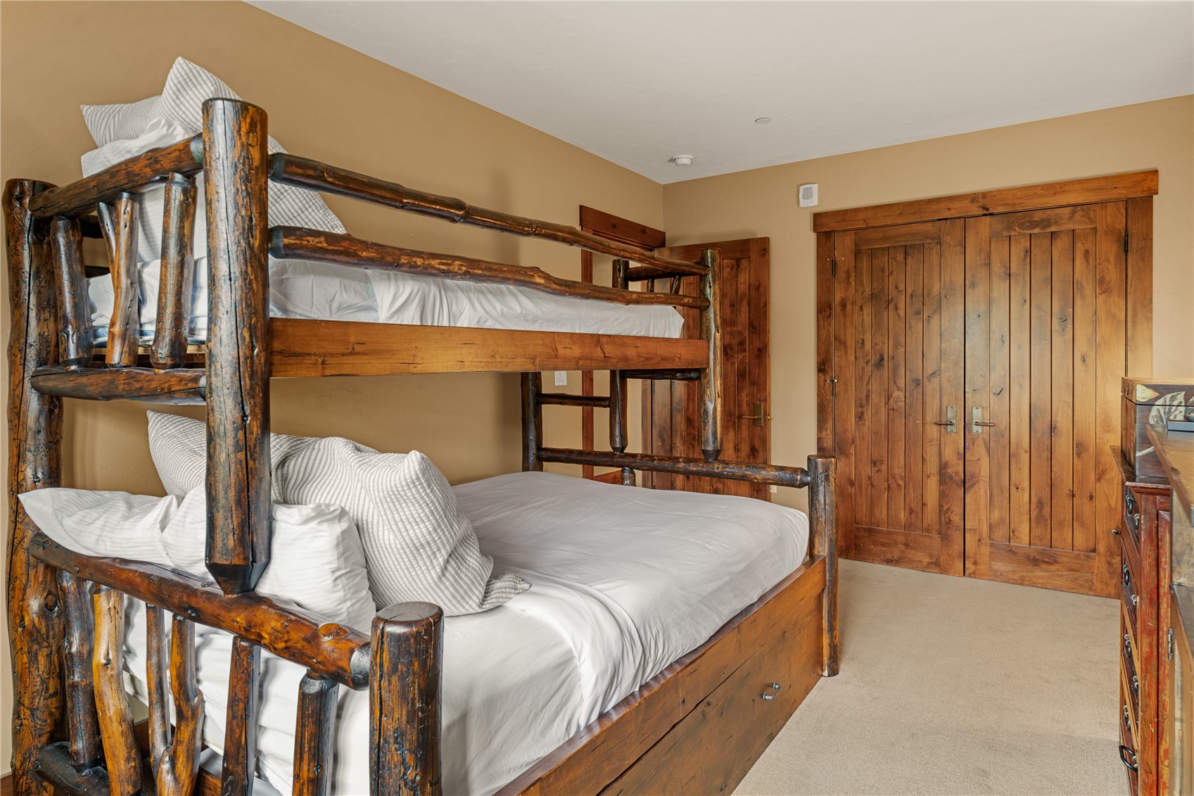 600 Columbine Road, Unit 5310 Breckenridge, CO 80424 - Photo 18 of 38 a bed sitting in a bedroom next to a window