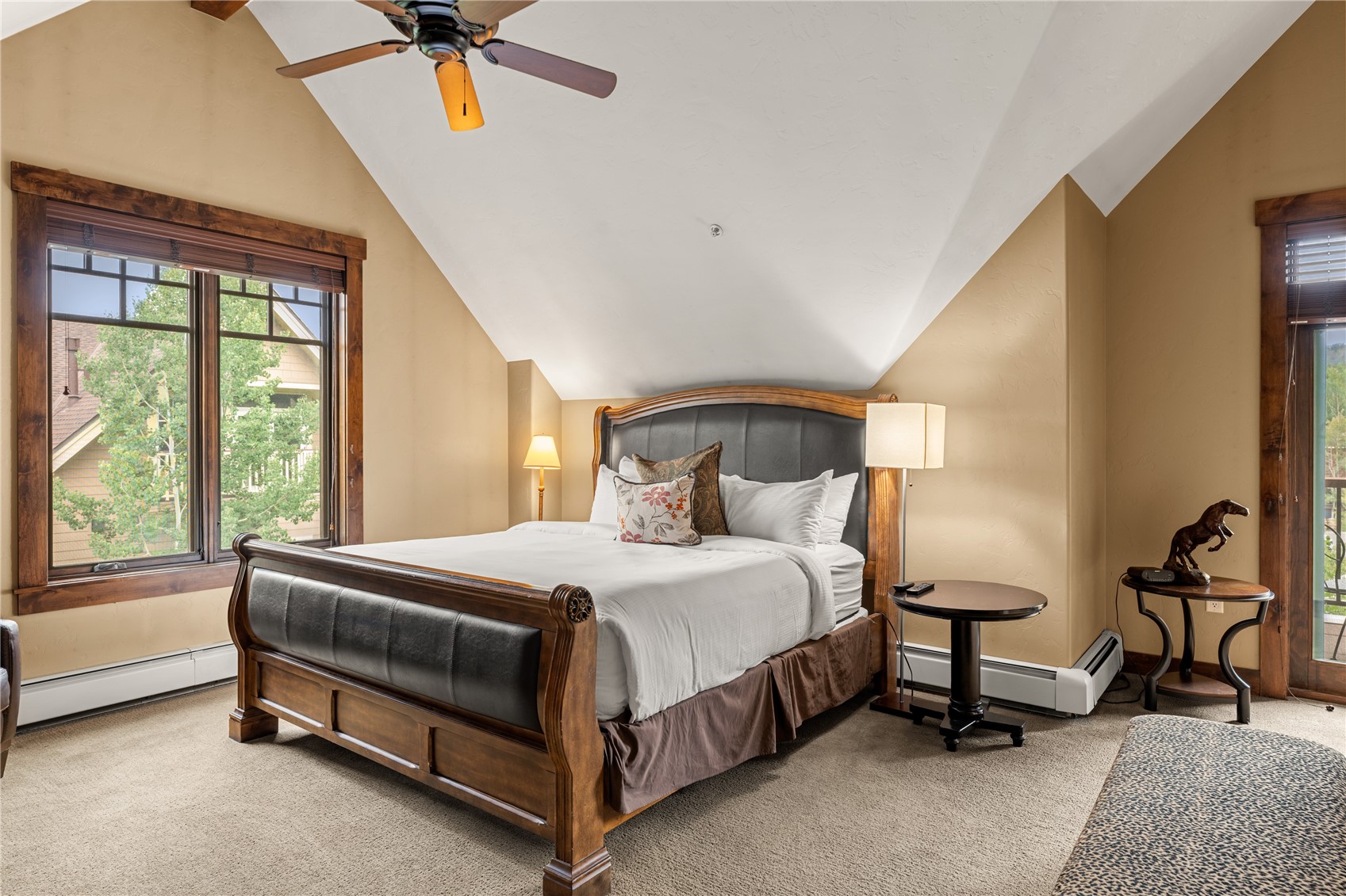 600 Columbine Road, Unit 5310 Breckenridge, CO 80424 - Photo 20 of 38 a bedroom with a bed a chandelier and a dresser next to a window