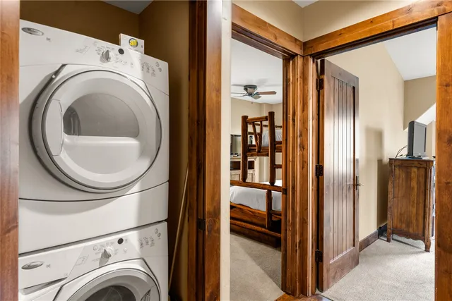 a view of a storage and utility room with washer and dryer