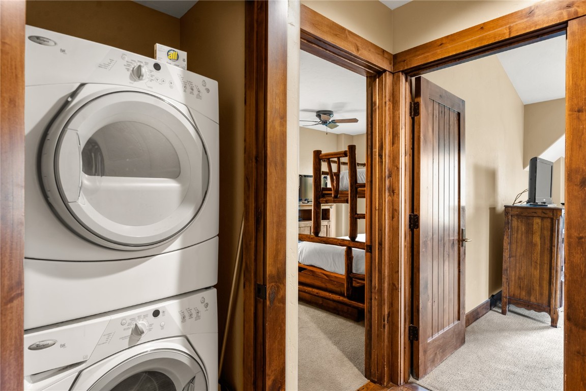 600 Columbine Road, Unit 5310 Breckenridge, CO 80424 - Photo 27 of 38 a view of a storage and utility room with washer and dryer
