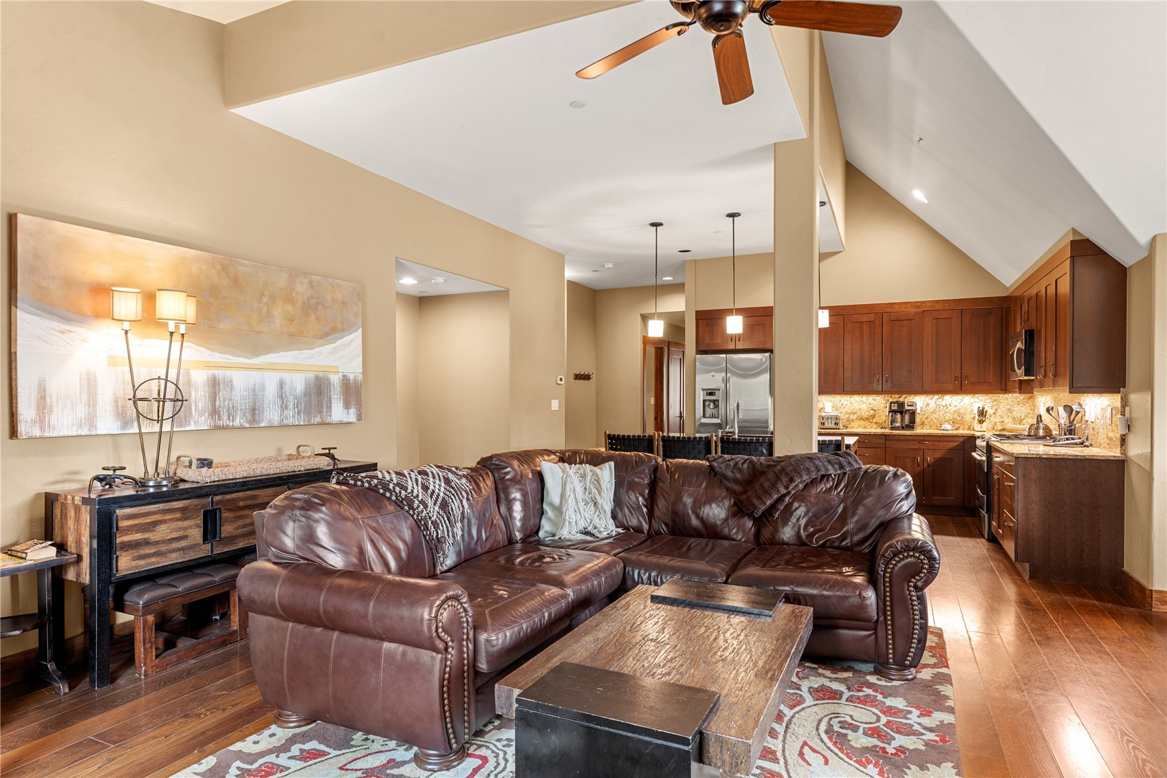 600 Columbine Road, Unit 5310 Breckenridge, CO 80424 - Photo 4 of 38 a large living room with stainless steel appliances kitchen island granite countertop furniture and a large window